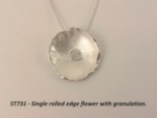 Single rolled edge silver flower pendant with granulation
